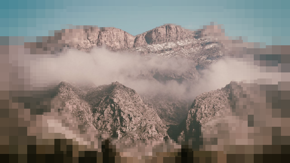 Mountains near Sulaymaniyah under cloud, sharp in the middle and pixelated toward the edges